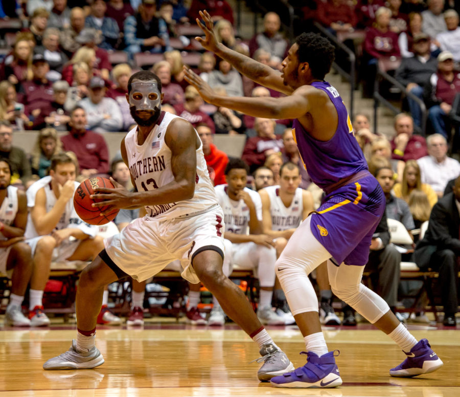 Junior guard Sean Lloyd Jr. looks to pass the ball Sunday, Jan. 21, 2018, during the Salukis 64-53 victory over the University of Northern Iowa Panthers at SIU Arena. (Brian Munoz | @BrianMMunoz)