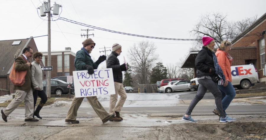 Protesters walk the streets Saturday, Jan. 20, 2018, during the Southern Illinois March to the Polls in Carbondale. (Dylan Nelson | @Dylan_Nelson99)