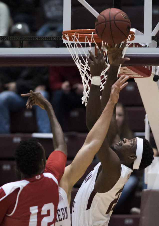 Junior guard Armon Fletcher blocks the ball Sunday, Feb. 11, 2018, during the Salukis 74-57 win against the Bradley Braves at SIU Arena. (Dylan Nelson | @Dylan_Nelson99)