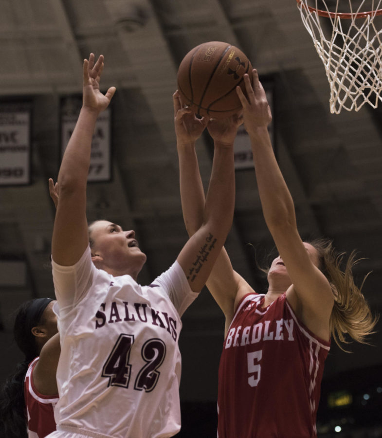 Junior forward/center Ashley Hummel grabs the ball during a match-up against the Bradley University Braves, the Salukis lead by 9 for a final score of 62-53 on Sunday, Feb. 11, 2018 at The SIU Arena. (Dylan Nelson | @Dylan_Nelson99)
