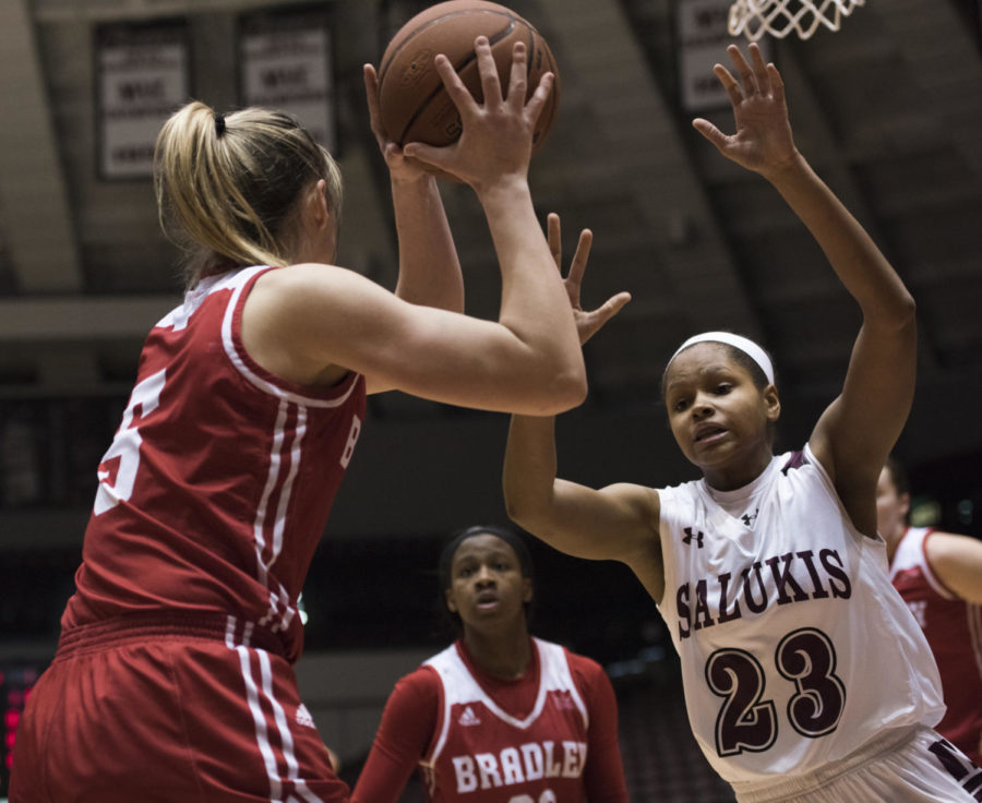 Sophomore guard Kristen Nelson reaches to block the ball during a match-up against the Bradley University Braves, the Salukis lead by 9 for a final score of 62-53 on Sunday, Feb. 11, 2018 at The SIU Arena. (Dylan Nelson | @Dylan_Nelson99)