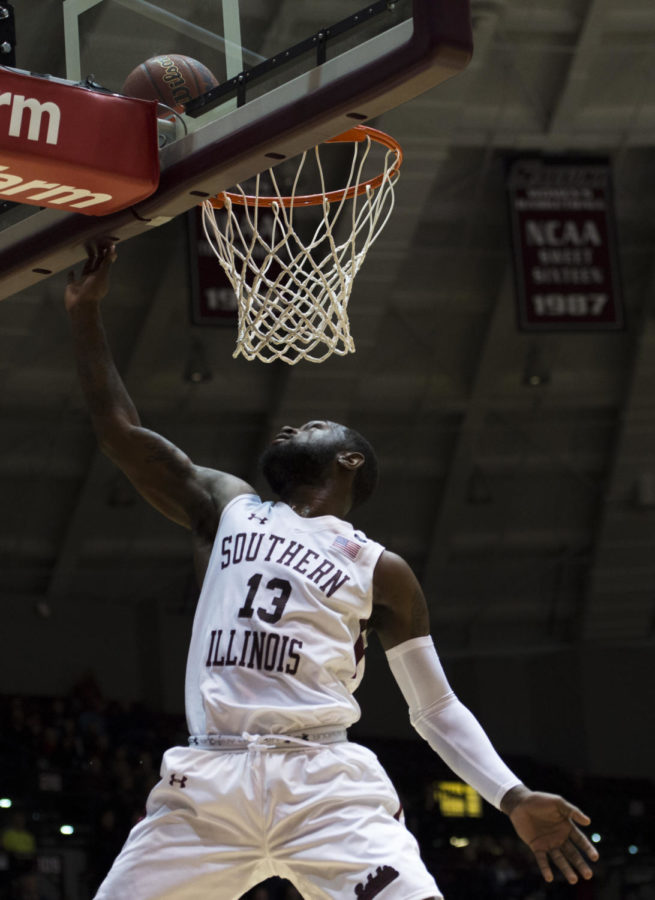 Junior guard Sean Lloyd dunks the ball Sunday, Feb. 11, 2018, during the Salukis 74-57 win against the Bradley Braves at SIU Arena. (Dylan Nelson | @Dylan_Nelson99)