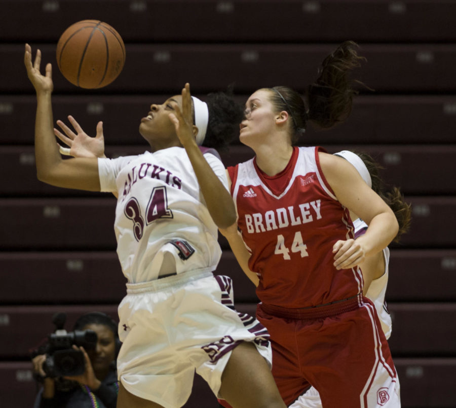 Sophomore forward/center Nicole Martin reaches for the ball during a match-up against the Bradley University Braves, the Salukis lead by 9 for a final score of 62-53 on Sunday, Feb. 11, 2018 at The SIU Arena. (Dylan Nelson | @Dylan_Nelson99)