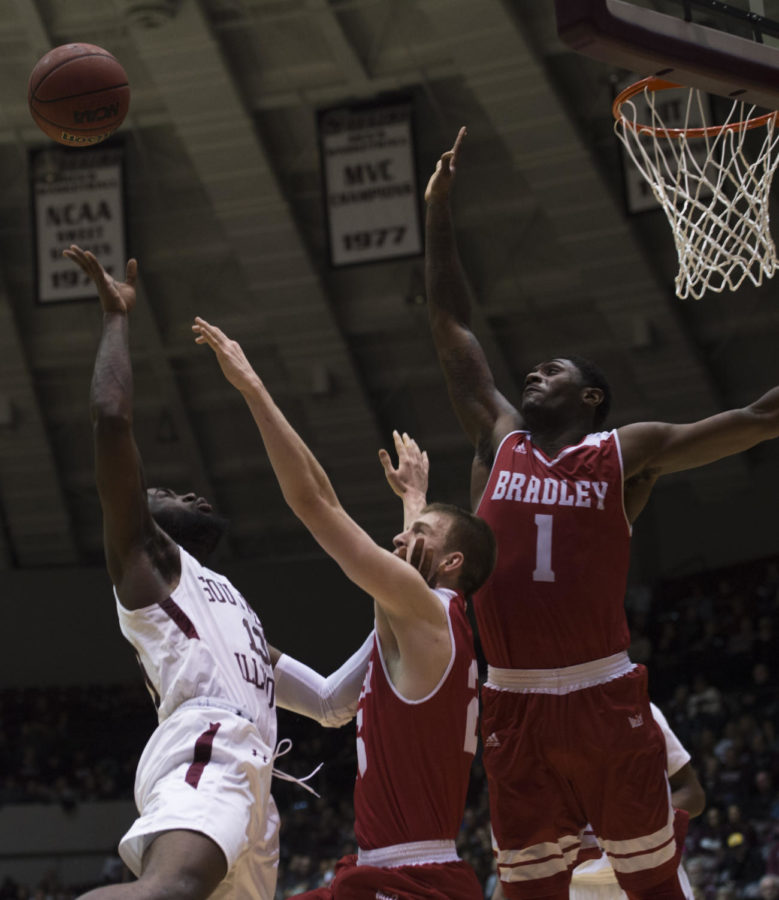 Junior guard Sean Lloyd jumps for the ball Sunday, Feb. 11, 2018, during the Salukis 74-57 win against the Bradley Braves at SIU Arena.  (Dylan Nelson | @Dylan_Nelson99)