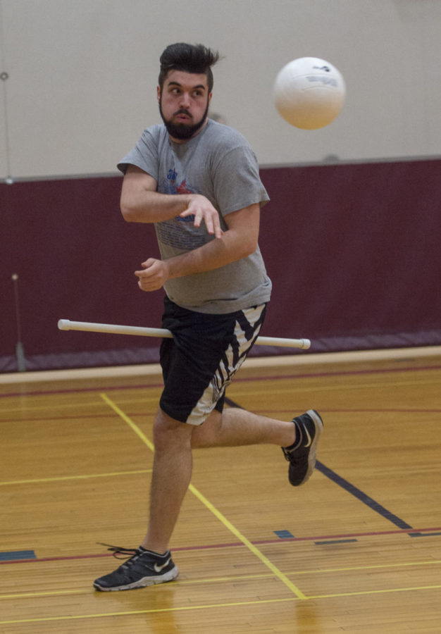Junior Computer Science major, Jeremy Devries, 21, passes the ball to his teammate Monday, Jan. 29, 2018 during quidditch practice at the student recreation center in Carbondale. (Dylan Nelson | @Dylan_Nelson99)
