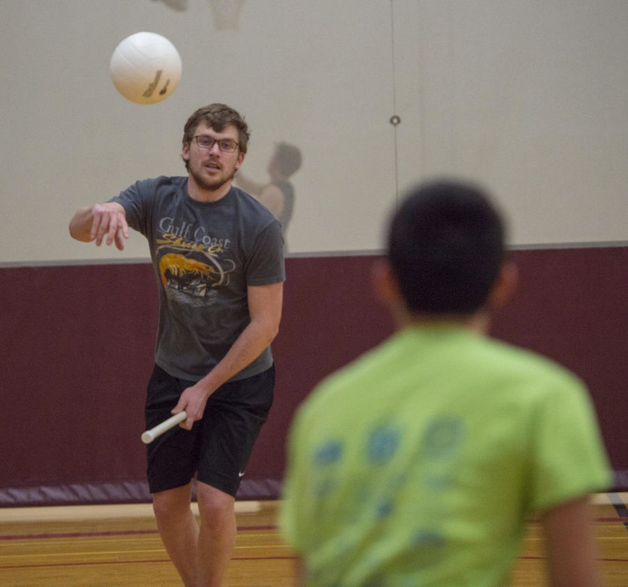 Junior Mechanical Engineering major Matthew Lunde, 20, passes the ball to his teammateMonday, Jan. 29, 2018 during quidditch practice at the student recreation center in Carbondale. (Dylan Nelson | @Dylan_Nelson99)