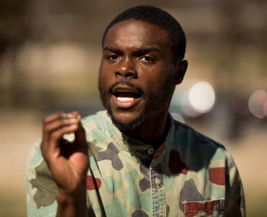Joshua Bowens, former SIU Undergraduate Student Government president, protests Tuesday, Feb. 27, 2018, outside of Morris Library. Bowens spoke on racial and social issues on the SIUC campus and said he there will be continued demonstrations for 12 days at 12:12 p.m. (Brian Munoz | @BrianMMunoz)