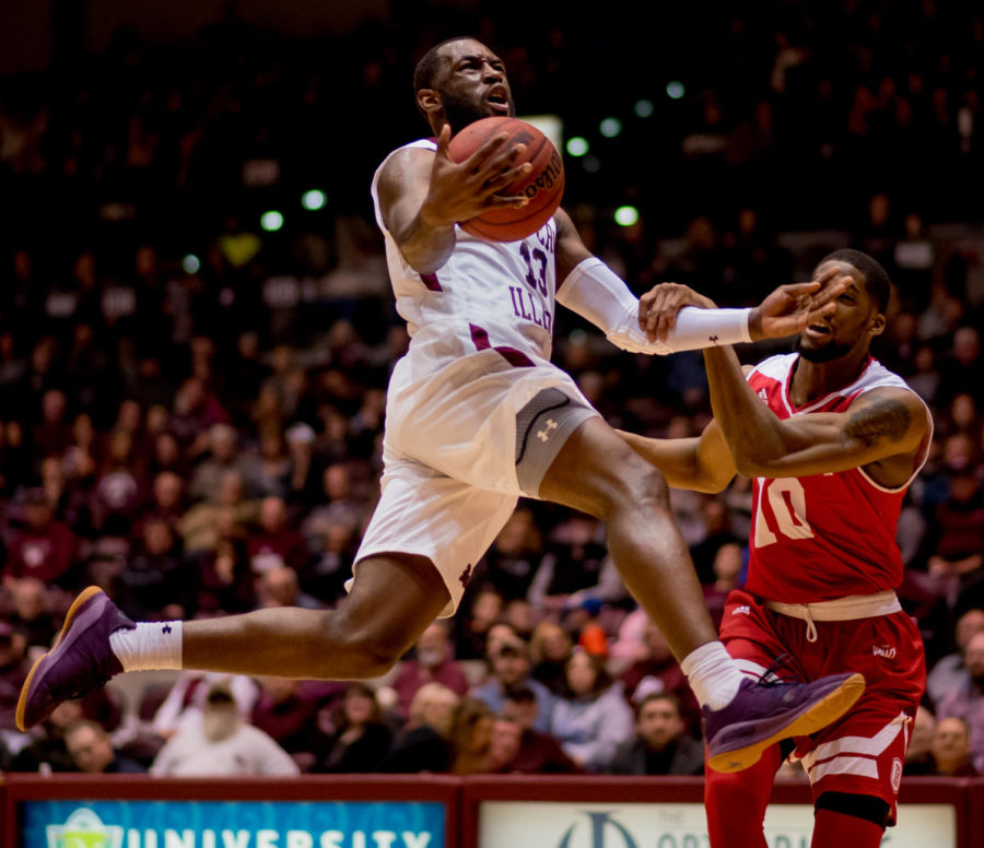 Bradley forward Elijah Childs, right, holds down Junior guard Sean Lloyd Jr. as he attempts to go for a basket Sunday, Feb. 11, 2018, during the Salukis 74-57 win against the Bradley Braves at SIU Arena. The Salukis are now the lone second place team in the Missouri Valley Conference. (Brian Munoz | @BrianMMunoz)