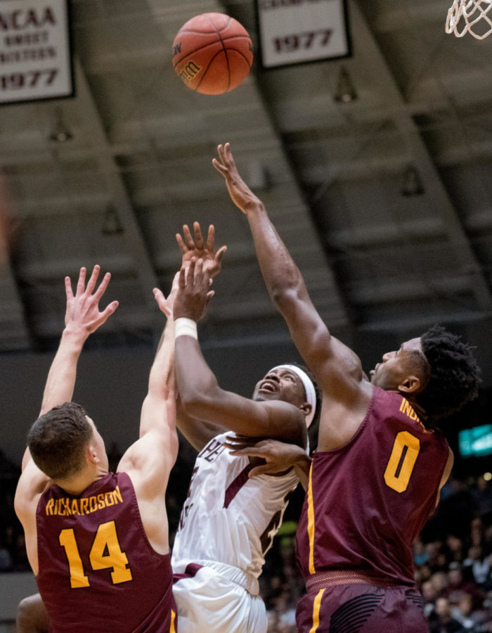 Junior guard Armon Fletcher looks up for the ball Wednesday, Feb. 21, 2018, during the Loyola Ramblers 75-68 victory against the Southern Illinois University Salukis at SIU Arena. (Cameron Hupp | @CHupp04)