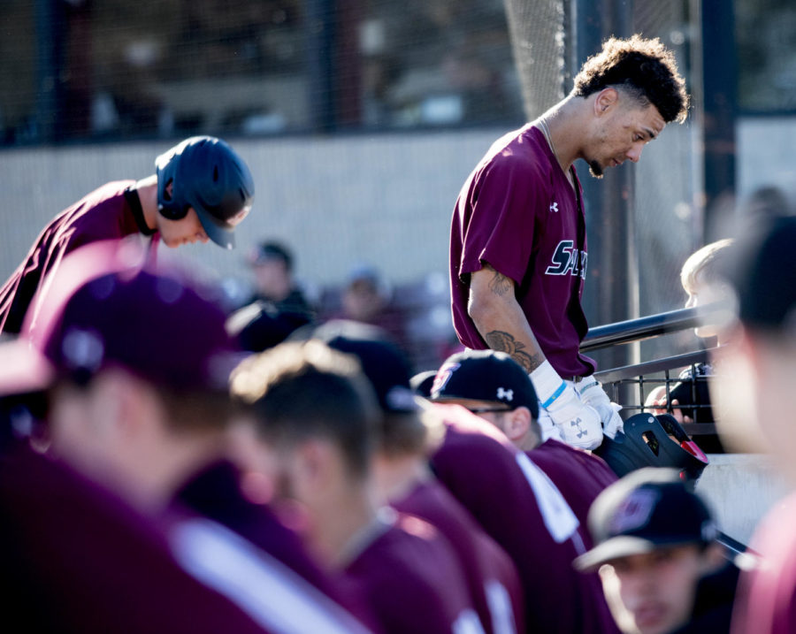 Junior outfielder Kenton Crawford takes a moment to think Friday, March 2, 2018, during the Louisiana Monroe’s Warhawks 5-4 win over the Salukis’ at Itchy Jones Stadium. (Cameron Hupp | @CHupp04)