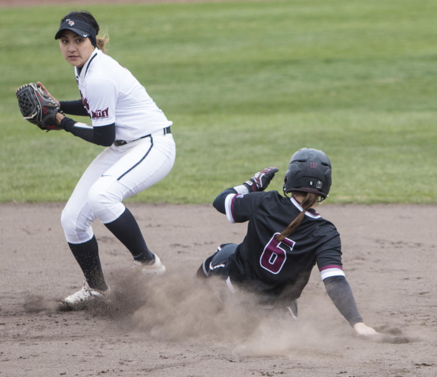 Saluki senior Savannah Fisher slides into second base during a play Sunday, March 25, 2018, during the Blackout Cancer game, where the Salukis took a 6-3 win against Illinois State University, at Charlotte West Stadium. (Corrin Hunt | @CorrinIHunt)