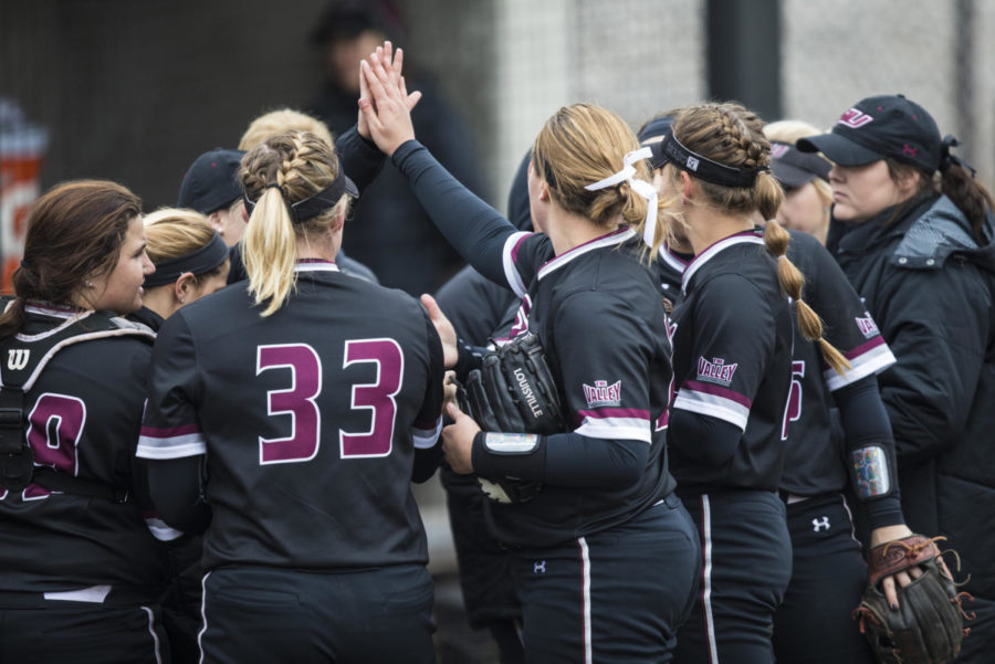 Saluki Softball members celebrate after an inning Sunday, March 25, 2018, during the Blackout Cancer game, where the Salukis took a 6-3 win against Illinois State University, at Charlotte West Stadium. (Corrin Hunt | @CorrinIHunt)