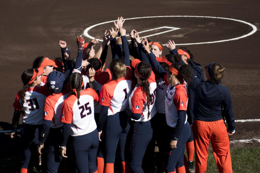 Members of the University of Illinois softball team rally before the Illinis 14-1 win against the Salukis, Friday, March 2, 2018, at Charlotte West Stadium Illinois. (Dylan Nelson | @Dylan_Nelson99)