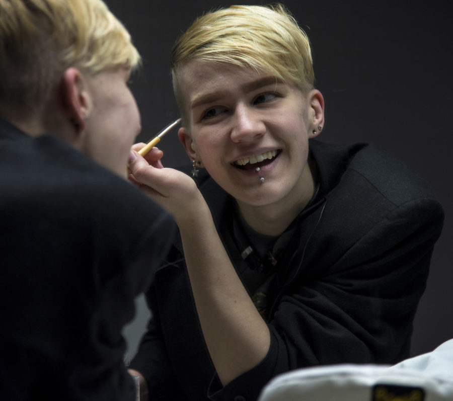 August Bishop, a senior studying fashion design, laughs while appling makeup, Saturday, April 7, 2018, during the Total Eclipse of the Heart drag show in the Student Center at SIU. (Mary Newman | @MaryNewmanDE)
