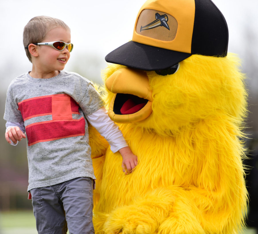 Joshua Thomas, 6, of Marion, says hello to the Miners mascot, Lucky, Saturday, April 21, 2018, during the Autism Society of Southern Illinois 5K color run childrens event at SIUs Lew Hartzog Track Complex. Thomas was diagnosed with autism spectrum disorder at 18-months-old. (Mary Newman | @MaryNewmanDE).
