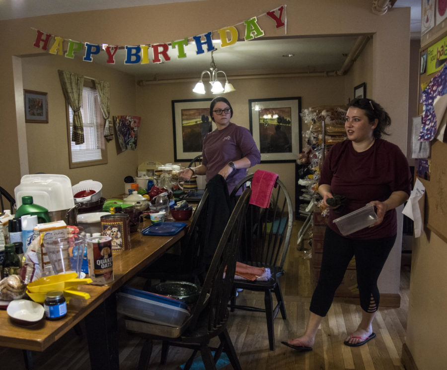 From left: Savannah Idecker, a sophomore studying dental hygiene, from New Athens, and Stephanie Majcen, a senior studying social work from Chicago, help to clean up a dining area, Saturday, April 7, 2018, at the Carbondale Women’s Center as volunteers for SIU’s The Big Event. Majcen is the Women’s Center food service manager. (Mary Newman | @MaryNewmanDE)
