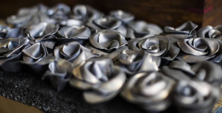 Part of a piece by Jam Lovell, a MFA candidate in sculpture from East Peoria, using roses cast in lead, pictured Friday, April 20, 2018, in her studio at the SIU Glove Factory. (Corrin Hunt | @CorrinIHunt)