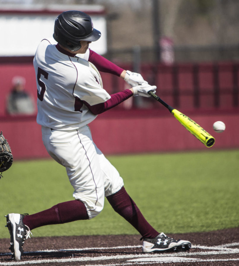 Southern Illinois freshman infielder Grey Epps makes contact with the ball, Saturday, April 7, 2018, during the Valparaiso University Crusaders 6-2 victory against the Southern Illinois Salukis at Itchy Jones Stadium. (Corrin Hunt | @CorrinIHunt)
