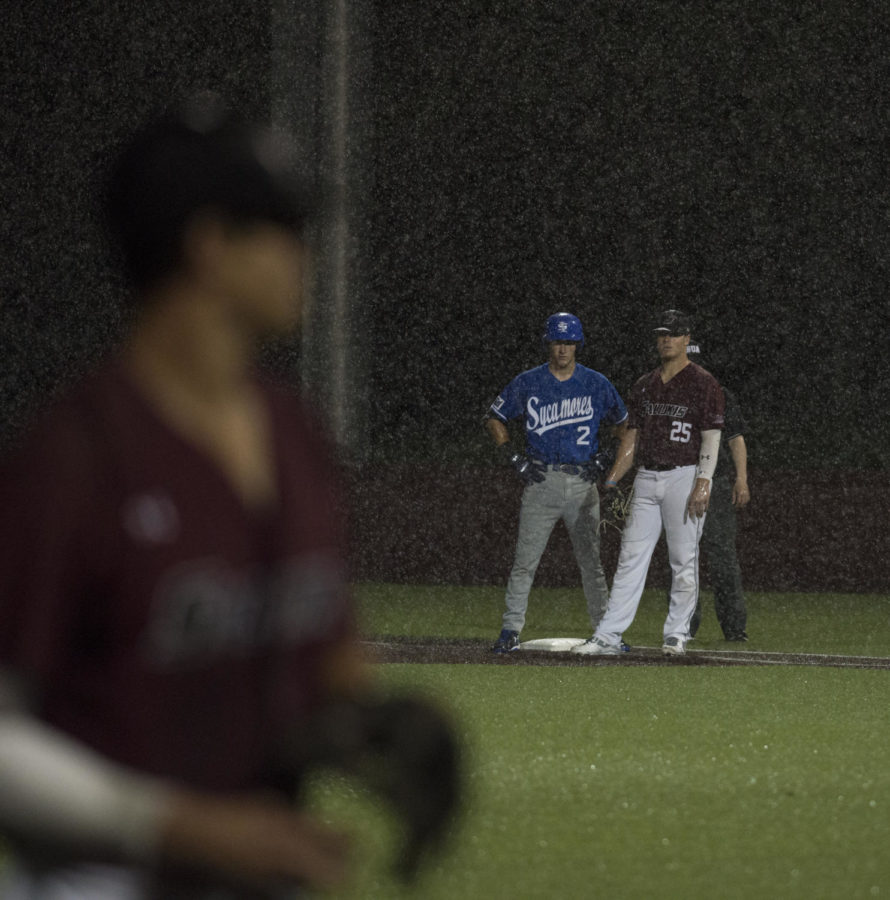 SIU infielder Logan Blackfan and Indiana State infielder Jarrod Watkins watch on as the rain starts to fall Friday, May 4, 2018, during the Salukis' 3-2 win against the Indiana State Sycamores at Itchy Jones Stadium. (Cameron Hupp | @CHupp04)