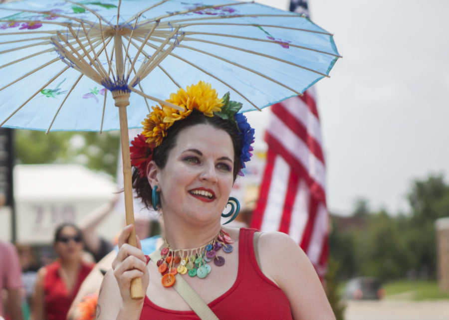Helen Sparkles Faree, a resident of Carbondale, marches in the Pride Walk. Though it is not Farees first pride march she thinks that Its awesome that Carbondale has a pride walk, Saturday, June 2, 2018, On the march from the Gaia House Interfaith Center to the Carbondale Pavilion. (Isabel Miller)