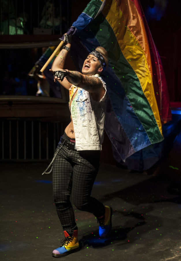 Faim Lee Jewls carries a large rainbow flag during his performance, Saturday, June 2, 2018, during the Rainbow Cafe benefit drag show at Street Bar in Carbondale. (Mary Newman | @MaryNewmanDE)