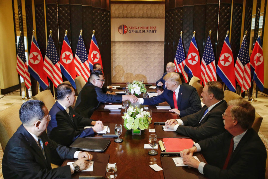North Koreas Kim Jong Un, third from left, shakes hands with U.S. President Donald Trump, third from right, in Singapore on Tuesday, June 12, 2018. (Kevin Lim/The Straits Times/Zuma Press/TNS)