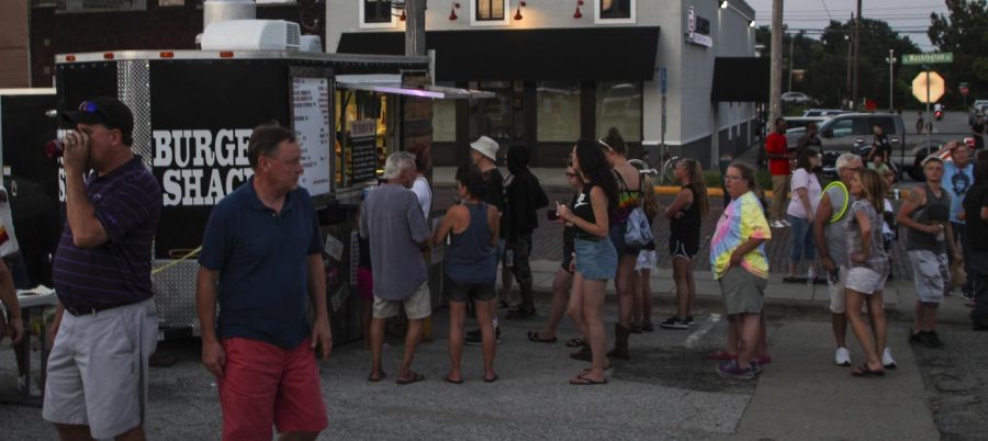 Patrons line up at the Burger Shack food truck, Thursday, July 12, 2018, at the Jungle Dogs concert at the Conrner of Route 13 and Washington Street for the Sunset Summer Concert Series. | Nick Knappenburger