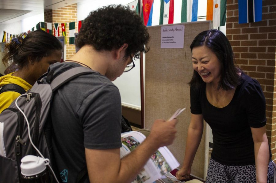 Dr. Shu-Ling Wu (right), 36, of Taiwan, speaks to Andrew Aaflaq (center), 20, of Carbondale, and Destiny Hurd (left), 21, of LaGrange, about her Chinese Language and Culture Program at SIU’s Study Abroad Fair Wednesday, Sept. 12, 2018. (Carson VanBuskirk | @carsonvanbDE)