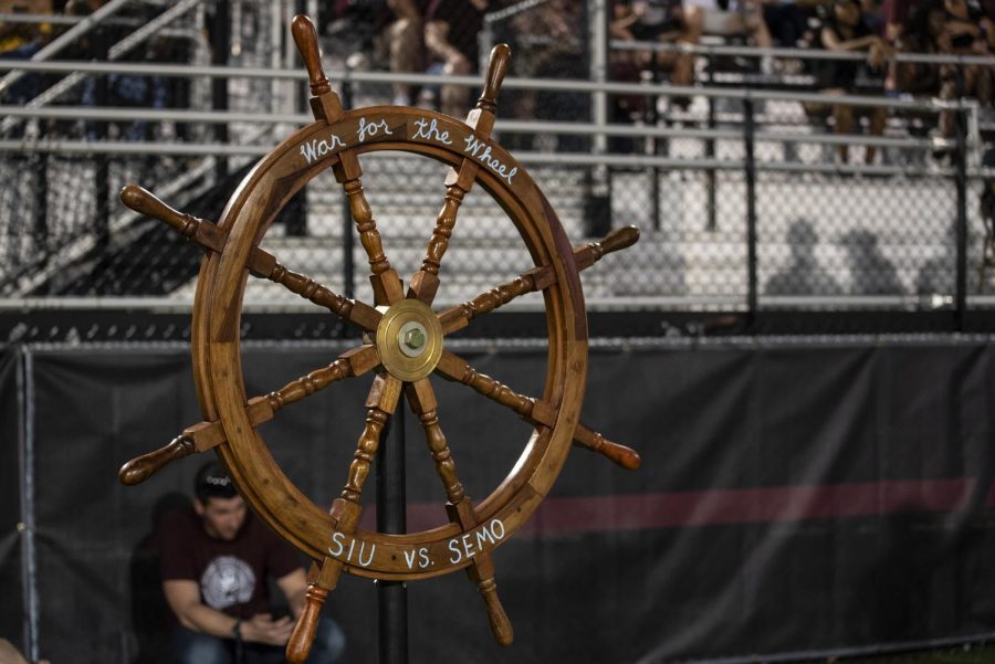SIU and SEMO’s Rivalry Wheel stands on the Saluki’s sideline after SIU’s win against SEMO in 2017. The Wheel left with SEMO after their 48-44 victory at the SIU versus SEMO football game at the SIU Arena, on Saturday, Sept. 15, 2018. (Carson VanBuskirk | @carsonvanbDE)