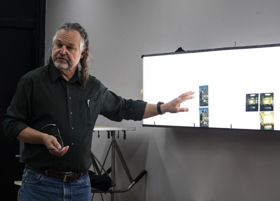 Daniel Overturf, a professor in the department of cinema and photography, shows his CP 431 class examples of 4x5 large format photographs taken with a view camera, Tuesday, Sept. 18, 2018. Overturf said one of the reasons they teach photography students how to produce photographs with a view camera is because it goes back to the traditions that photography is built off of today. (Allie Tiller | @allietiller_de)