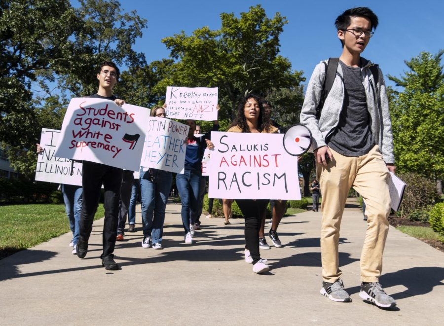 Zhi Hao “Eric” Tsang, 22, of Malaysia, studying marketing, leads the Rally Against Racism around campus. (Carson VanBuskirk | @carsonvanbDE)