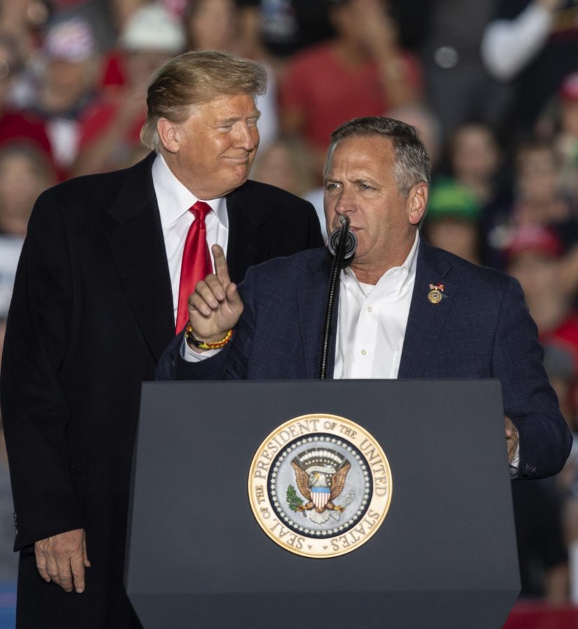 Congressman Mike Bost addresses the crowd with President Donald J. Trump, during the Murphysboro campaign rally, Saturday, Oct. 27, 2018, at the Southern Illinois Airport. (Isabel Miller | @IsabelMillerDE)