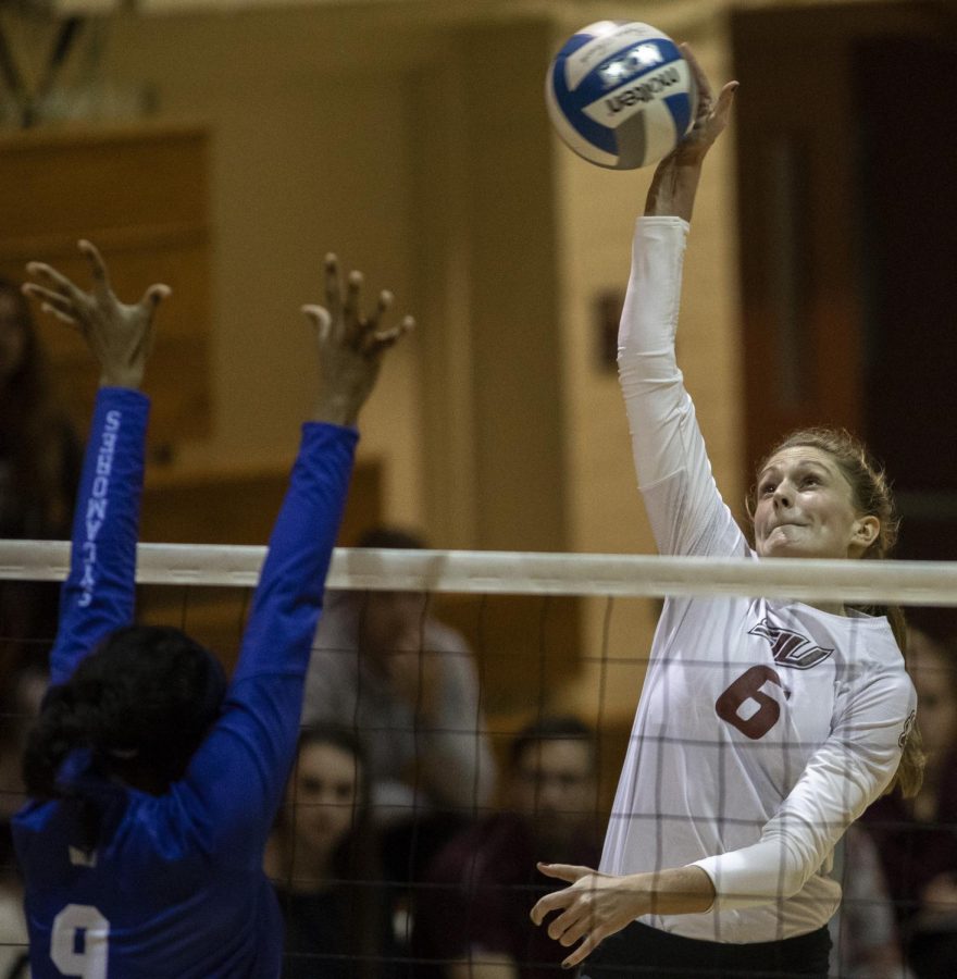 Junior opposite hitter, Emma Baalman, spikes the ball, Friday, Nov. 2, 2018, during the Saluki’s 3-1 win againt the Indiana Sycamores, at Davies Gym. (Isabel Miller | @IsabelMillerDE)