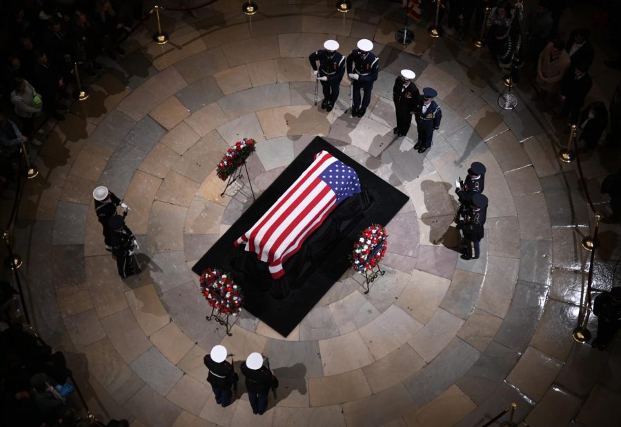 Sub.
Joint services military honor guards stand next to the flag-draped casket of former U.S. President George H.W. Bush on the Lincoln catafalque during a memorial service at the Capitol Rotunda on Dec. 3, 2018 in Washington, D.C. (Olivier Douliery/Abaca Press/TNS)