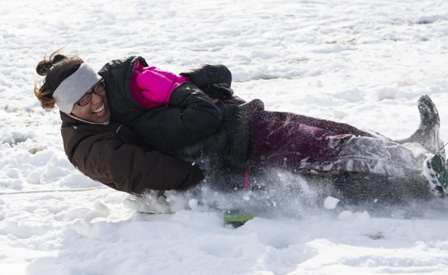 Six-year-old Ella Fehrenbacher and her mother Leslie Fehrenbacher sledding Sunday, Jan. 20, 2019, on Pleasant Hill Road next to the Carbondale Reservoir. Leslie Fehrenbacher said it is great to be outside, it lets her and her daughter get some energy out instead of being stuck inside. 