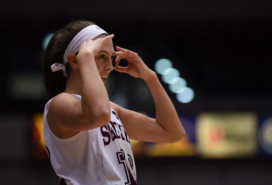 Southern Illinois Salukis guard Makenzie Silvey reacts after the Saluki team made a three point shot on Sunday, Jan. 27, 2019, during the Southern Illinois Salukis 74-63 win over the Loyola Ramblers at SIU Arena. 