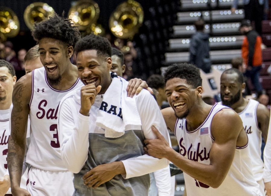 Junior guard Aaron Cook, right, holds on junior guard Brenden Gooch as the team celebrates on Wednesday, Jan. 23, 2019, after the Salukis 70-62 win against the University of Northern Iowa Panthers at SIU arena. 

