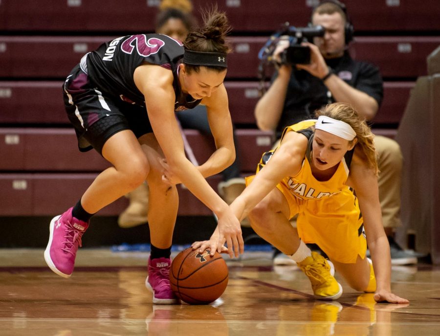 Southern Illinois Salukis guard Makenzie Silvey and Valparaiso Crusaders guard/forward Grace Hales fight for a loose ball on Friday, Jan. 25, 2019, during the Southern Illinois Salukis 87-65 win over the Valparaiso Crusaders at SIU Arena. 