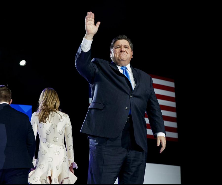 Governor J.B. Pritzker waves after being sworn into office by Judge James Snyder at the Bank of Springfield Center Monday, Jan. 14, 2019, in Springfield, Ill.