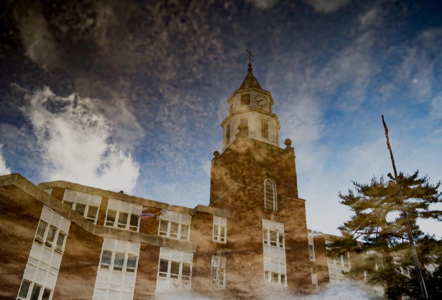 Pulliam Hall is reflected in a puddle on Wednesday, Feb. 20, 2019, outside of Pulliam Hall in Carbondale, Illinois. 