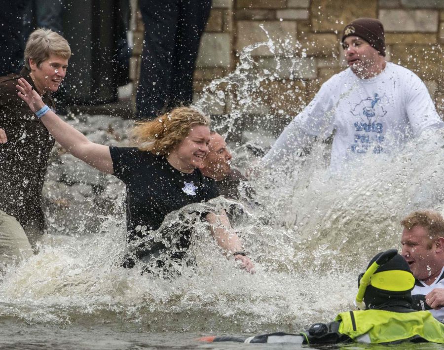 Jackson County officers plunge into the 42 degree water on Saturday, Feb. 23, 2019 during the Polar Plunge in support of the for the Special Olympics Illinois at SIU Campus Lake.
