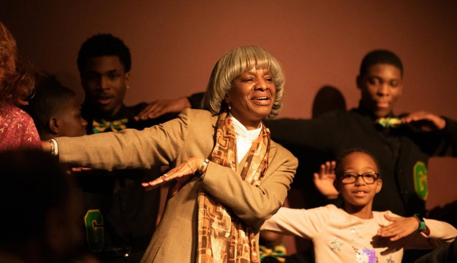 Pamela Smoot, history assistant professor, dances on stage with the Gentlemen of Vision Monday, Feb. 4, 2019 inside the Student Center Auditorium. The Gentlemen of Vision are St. Louis area high school students and performed a step show during the Black History Month Kickoff event.