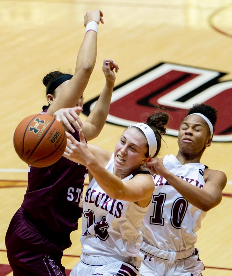 Southern Illinois Salukis guard Makenzie Silvey attempts to take control of a loose ball on Friday, Feb. 8, 2019, during the Southern Illinois Salukis matchup against the Missouri State Lady Bears at SIU Arena. 

