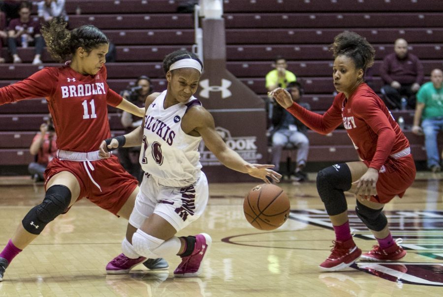 Saluki junior guard Brittney Patrick fights for the ball on Friday, Feb. 15, 2019, during the Salukis' 55-62 win against the Bradley Braves at SIU Arena.