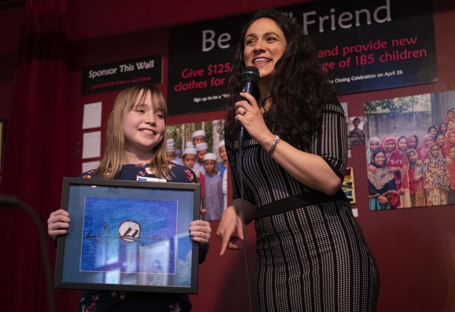Elise Warshawsky presents her art alongside For Kids’ Sake Director, Shema Ruperto, at the For Kids’ Sake Art Auction on Friday, March 22, 2019, in Longbranch Cafe and Bakery. 