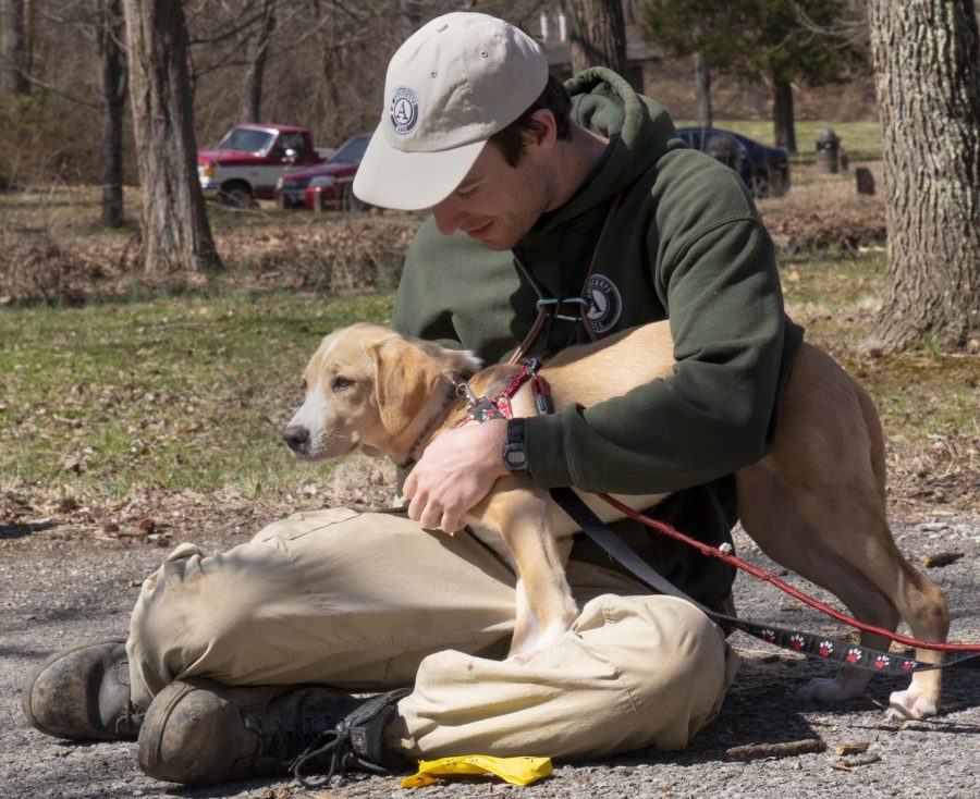 Ted Randich pets Karen on Saturday, March 23, 2019, for Wright Way Animal Rescue’s “Hike with a Homeless Dog” event at Giant City State Park. 