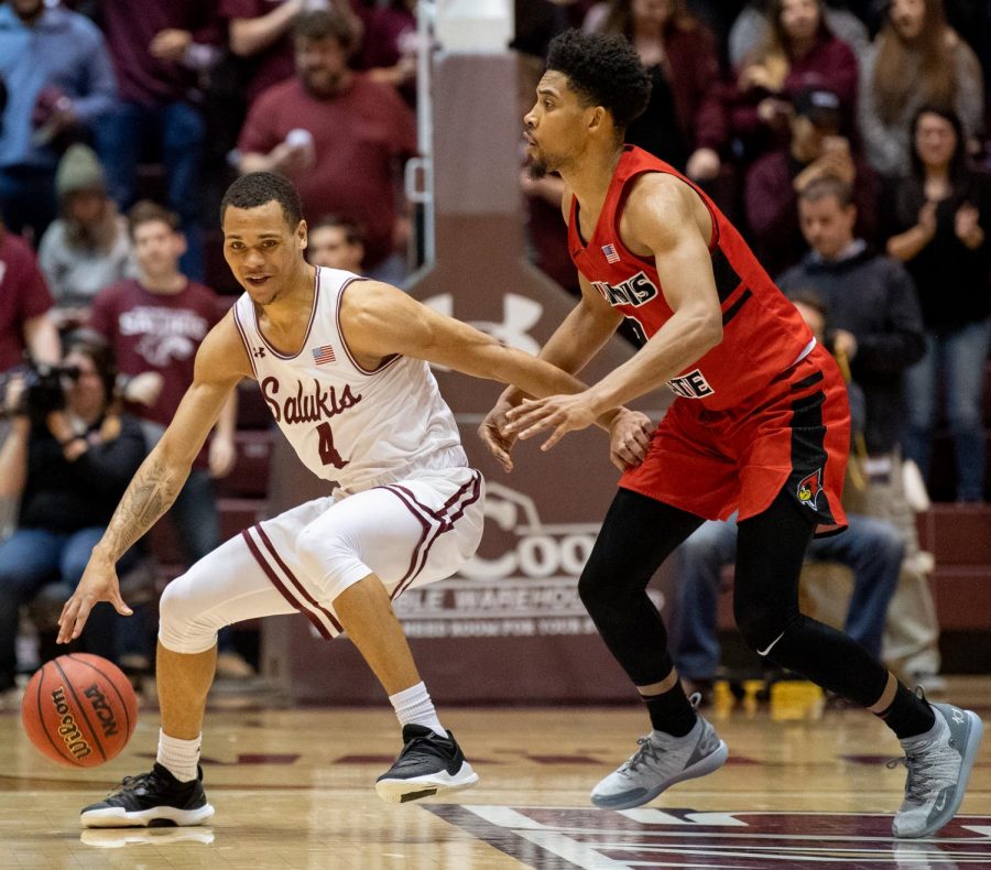 Southern Illinois Salukis guard Eric McGill attempts to get the ball past Illinois State Redbirds guard Zach Copeland on Saturday, March 2, 2019 during the Salukis' 72-63 win over the Illinois State Redbirds at SIU Arena in Carbondale, Illinois. 