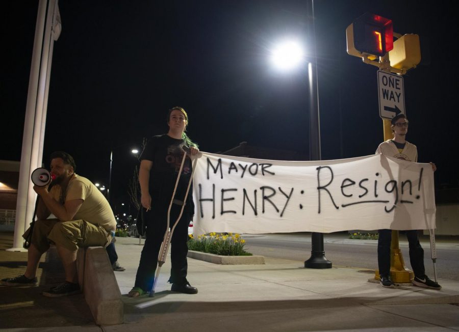Protestors speak out against re-elected mayor Mike Henry on April 10, 2019, at Carbondale’s City Hall after contradicting evidence was released concerning a domestic dispute in the mayor’s home. 