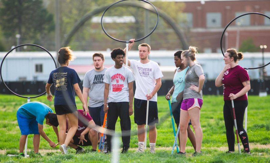 The SIU Quidditch team talks among themselves, on Thursday, April 12, 2019 during their last practice before nationals. 