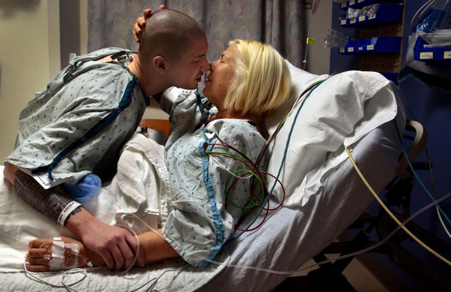 Thank you, says Kasey Bergh as she kisses her husband Henry Glendening goodbye in the preoperative area before he donates a kidney to her at Barnes-Jewish Hospital on Tuesday, April 9, 2019. More than three hours later, Glendenings kidney would be walked from his operating room to hers next door. 